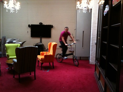 Colman cycling round the office