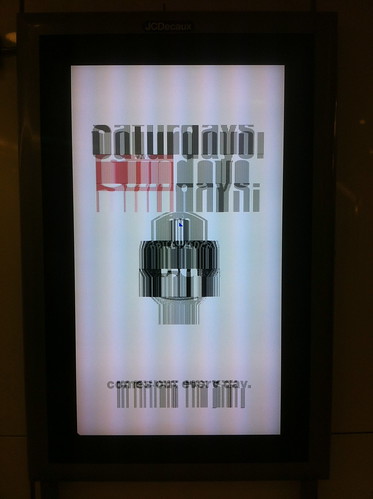Adverts via broken screen at Stratford station