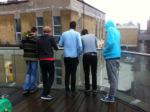 Some designers on a roof