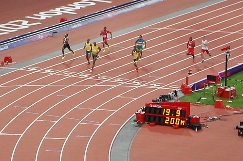 Usain Bolt about to cross the line